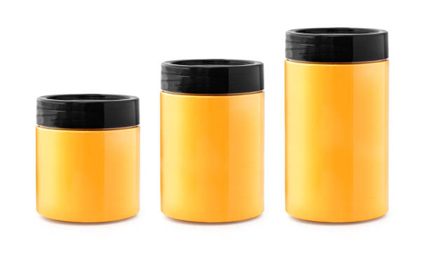Set of Glass jars with honey, or apricot jam isolated on a white background