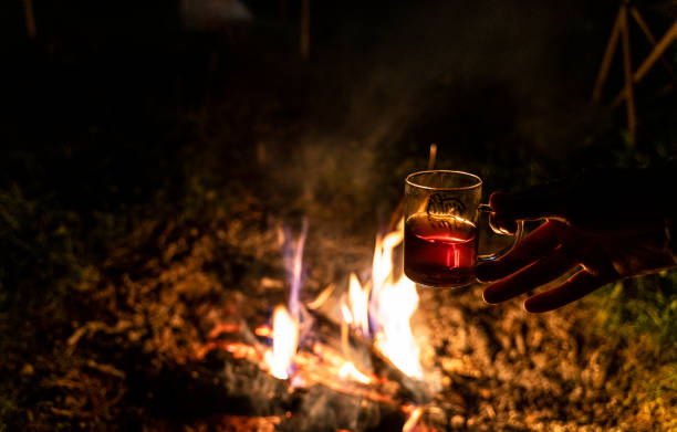 istock Hot tea background in front of campfire at dusk 1401177274