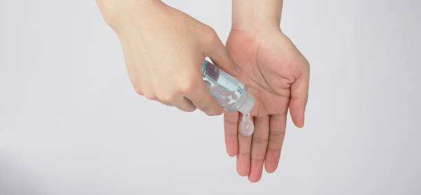 istock Hands is squeezing alcohol hand gel on white background.TOP eye view. 1401178383