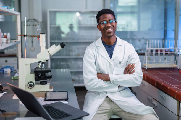 istock Young African-American Scientist Standing In Laboratory 1401178913