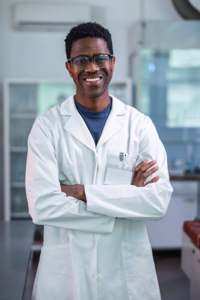 Young African-American Scientist Standing In Laboratory stock photo