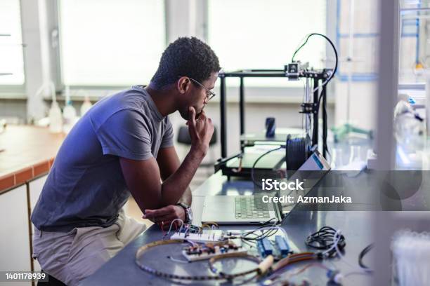 Young Designer During His Work In Laboratory Stock Photo - Download Image Now - 3D Printing, Electronics Industry, Engineer