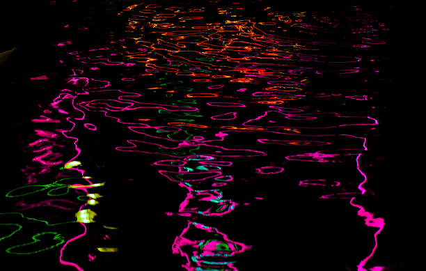 istock Abstract dark background with wavy neon lines. 1401180157