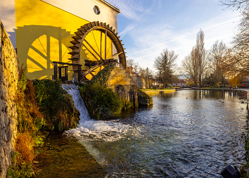 Scenic view of water turbine with falling water of river at park