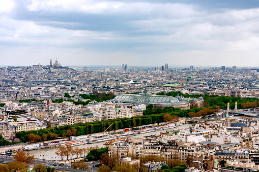 aerial shot of Trocadero, Jardins du Trocadero, Palais de Chaillot in Paris. The business district of La Defense, sits in the background just outside of Paris proper.