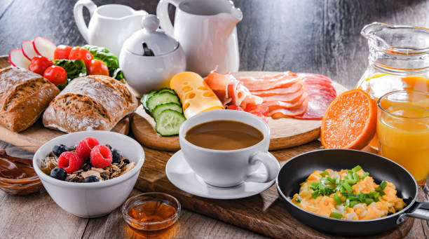 istock Breakfast served with coffee, scrambled eggs, cereals and ham 1401183500
