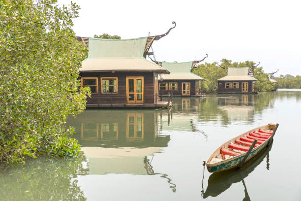 istock Canoe and houses in Gambia 1401190969