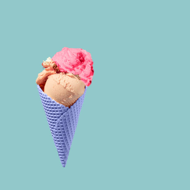 istock Flying or levitating waffles purple cornet , with strawberry ice cream and  blue background.Summer creative copy space made of waffle cone and ice cream strawberry and cokolade 1401194968