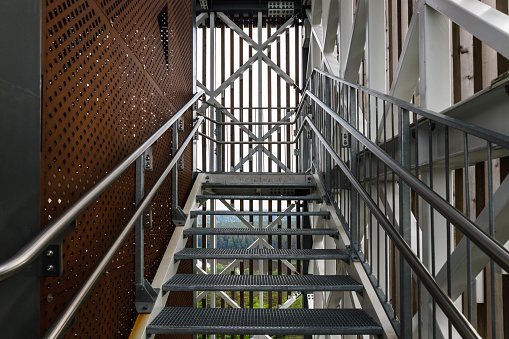 Moving up on outdoor escalator in urban city