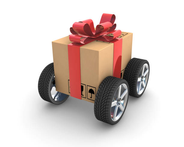 istock Gift Cardboard with Red Ribbon on wheels 1401205588