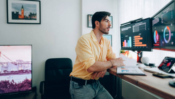 istock Man working at standing desk at home 1401205631
