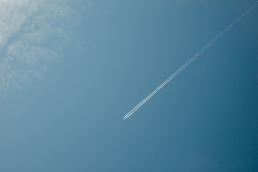 Frankfurt Germany Europe aircraft jet trails passing  in the sky.