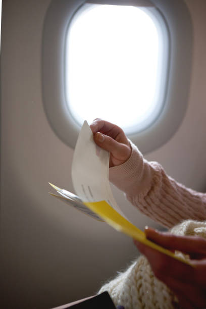 istock Woman holding boarding pass 1401209981