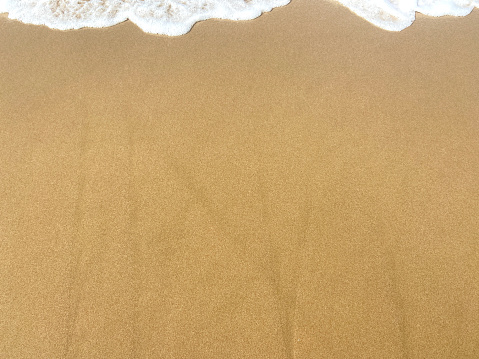 High angle view sand and sea wave background, beach