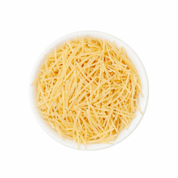 istock Vermicelli in a white cup on a white background. View from above 1401211160