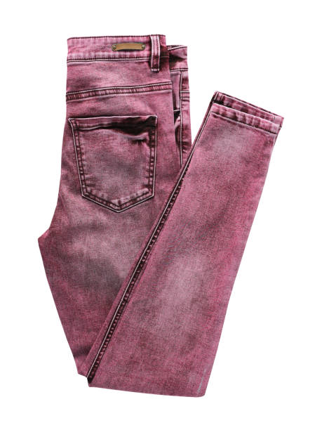 istock Pink denim jean folded half pack shot isolated on white 1401212540