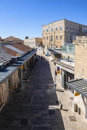 East Jerusalem, Palestine, May 5, 2019: Aerial view of the Ha Sha´ar he-Khadash Street above the New Gate in the Christian Quarter of the Old City. In the background is the College des Freres. The entire Jerusalem Old City is listed as UNESCO World Heritage Site.