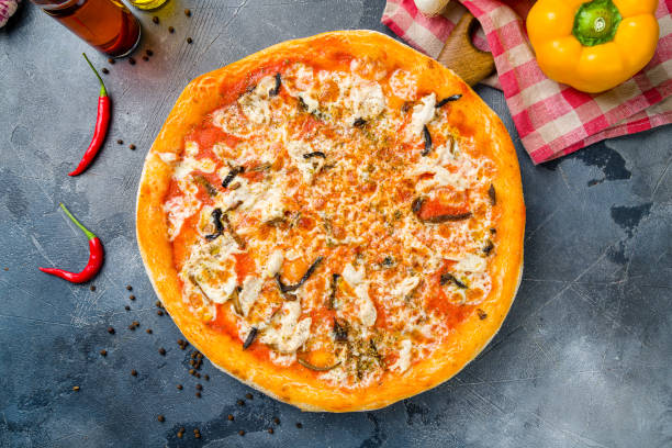istock Pizza with eggplant and cheese with tomato sauce on grey table top view 1401215796