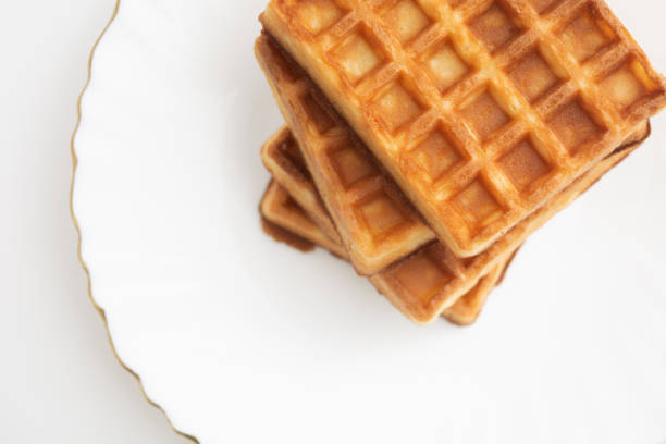 istock Stack of waffles on white plate with white background. Top view 1401216832