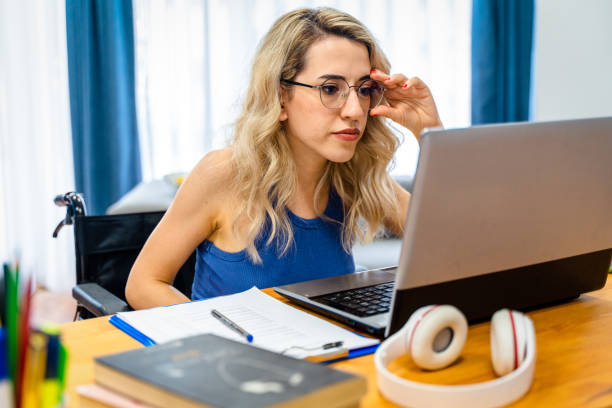 istock Disabled woman working at home 1401216855