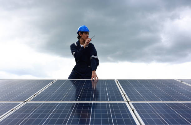 istock Solar Engineer wearing safety PPE work in solar Farm, Daily Solar panel inspection ,Renewable and Green energy concept 1401219917
