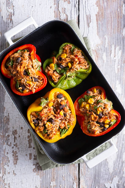 Southwestern Stuffed Peppers Southwestern Stuffed Peppers with Chicken, Rice, Black Beans, Tomato and Corn stuffed pepper stock pictures, royalty-free photos & images