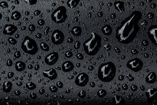 Water drops on black background stock photo