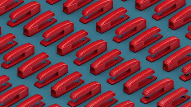 3D Illustration of a Pattern of Red Staplers Isolated on Isometric Blue Background with Clipping Path. Office Product Concept. stock photo