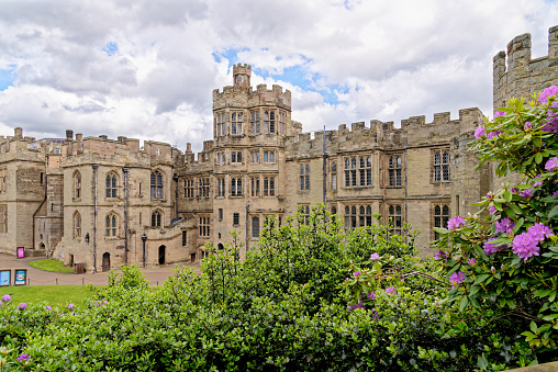 An ultra wide view of the medieval Windsor Castle and gardens bathed in glorious sunny weather