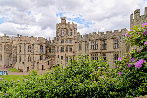 Medieval Warwick Castle in Warwickshire - England Warwick Castle - medieval castle in Warwick, Warwickshire - England, United Kingdom. Built by William the Conqueror in 1068. 20th of May 2022. warwick uk stock pictures, royalty-free photos & images