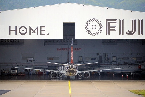 Nadi, Viti Levu island, Fiji: stern view of a Boeing 737-800 at the Fiji Airways main hangar at Nadi International Airport, Nasoso.