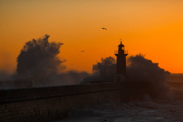 istock Lighthouse with huge wave at Atlantic ocean, Porto, Portugal. 1401227214