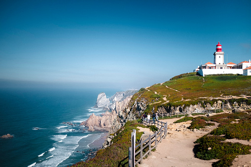 View of the Cabo da Roca Lighthouse. Sintra, Portugal. Portuguese Farol de Cabo da Roca is a cape which forms the westernmost point Eurasian land mass.