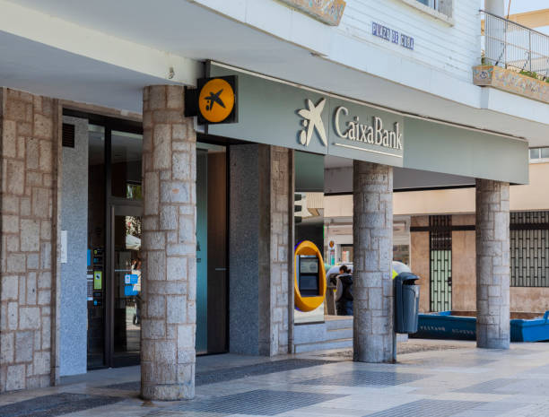 CaixaBank branch in central Seville, Spain stock photo