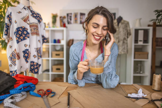 istock Young fashion designer working in her tailor studio 1401229319