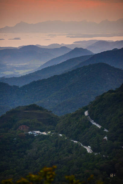 A winding road climbing from the coastal plains to the Serra dos Órgãos stock photo