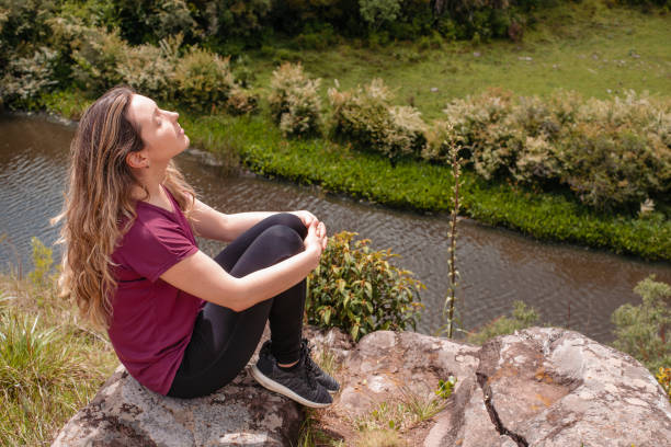 istock Woman enjoying the warm sunlight in nature. 1401233251