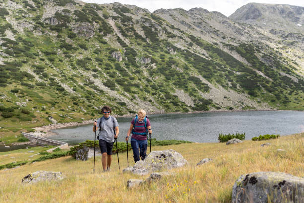 istock A couple are hiking in the mountains 1401239286