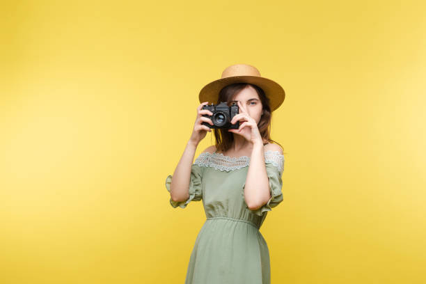 istock Young girl in straw hat and glasses keeping camera 1401239423
