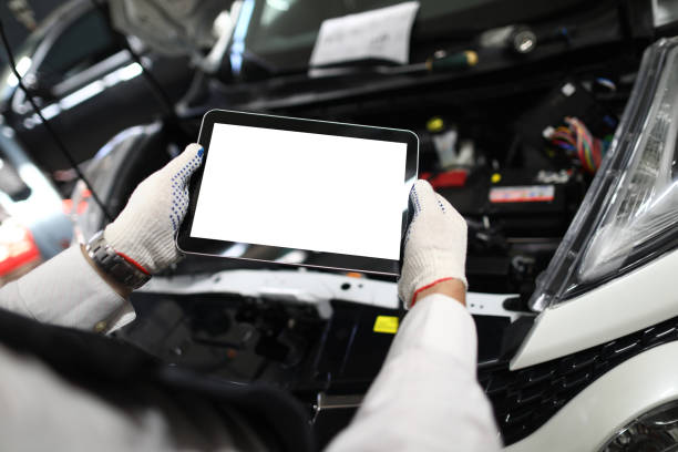 istock Mechanic worker using tablet for diagnostics of technical condition of vehicle 1401239519