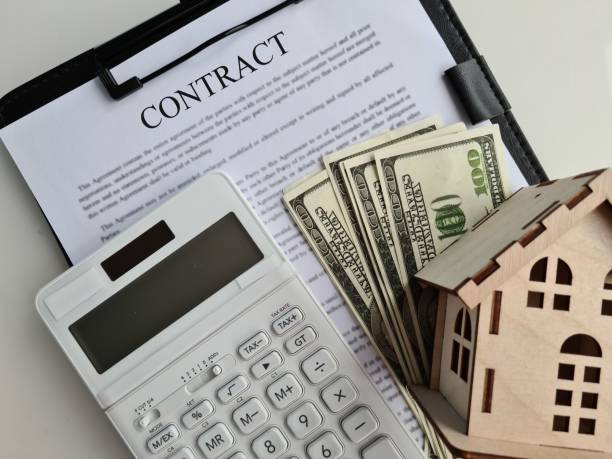 istock Contract agreement buying or renting housing dollars 1401239903
