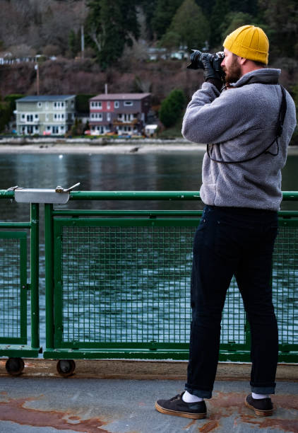 istock Photographer on the Ferry 1401240435