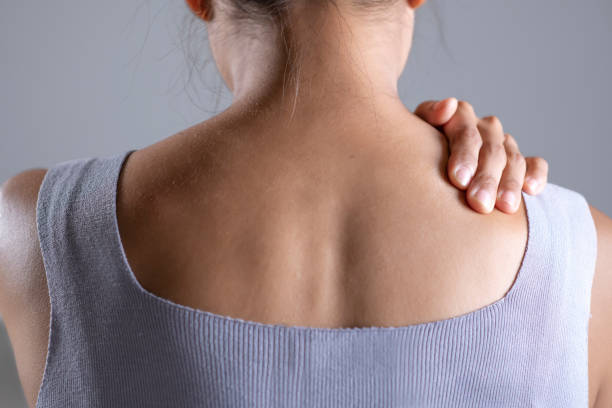 istock Woman has shoulder pain. 1401241684