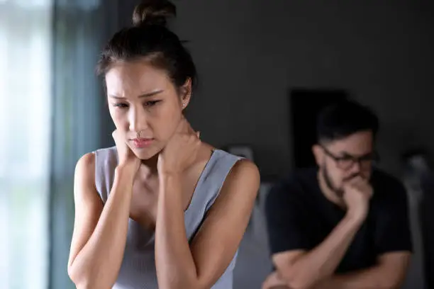 Asian couple arguing at home. Problems in relationship. Family crisis conflict concept. Conflicts in marriage, upset couple after fight dispute.