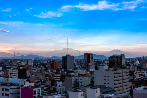 istock Mexico City downtown with volcanoes 1401242728