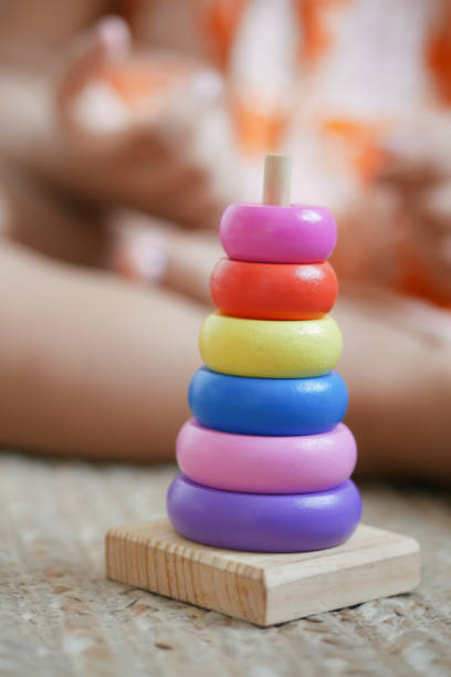 istock child playing with a Baby toys on bed, Child development concept. 1401256277