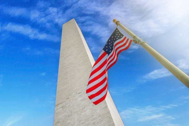 istock Washington monument with the USA flag on a sunny day. 1401257085