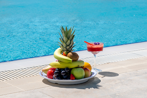 Delicious fruit plate by the pool