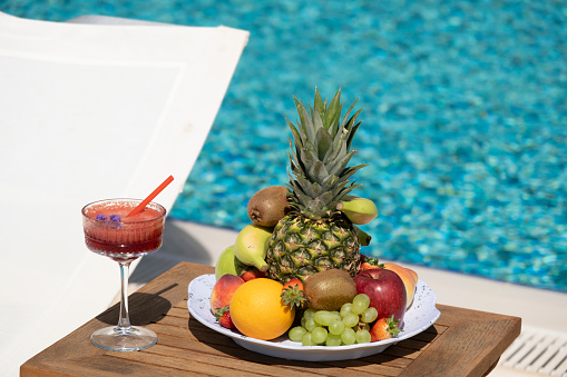 Delicious fruit plate by the pool