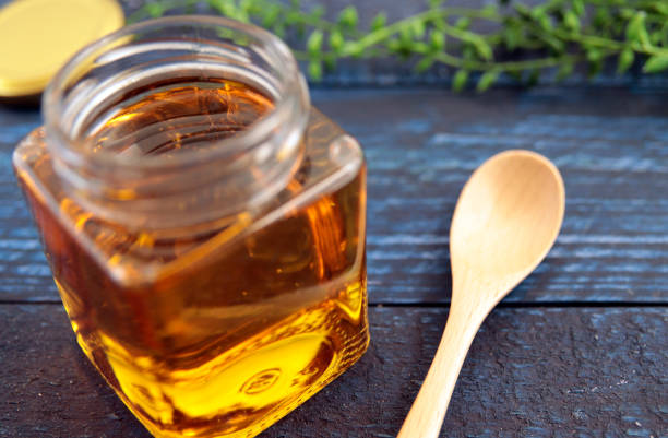istock Honey in a cosmetological jar on the table 1401259146